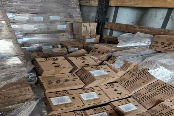 A damaged box next to a pristine box