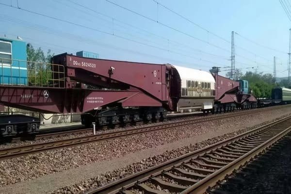 Oversized industrial equipment loaded onto a special flatcar train