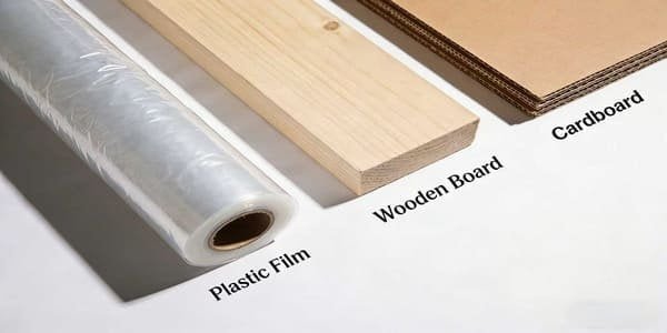 A collection of different packaging materials like wood, cardboard, and plastic wrap