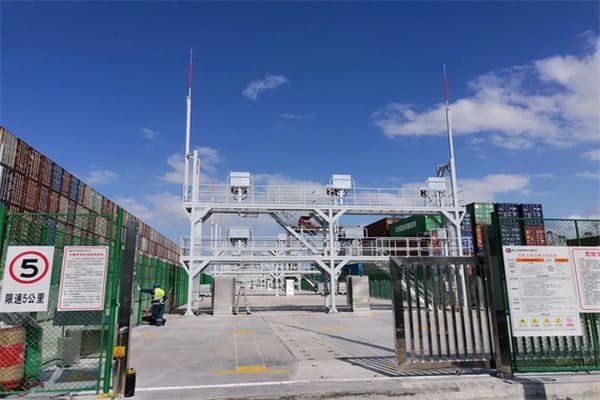 A shipping container yard with a specific section for dangerous goods containers