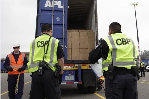 A truck moving a container to a Centralized Examination Station