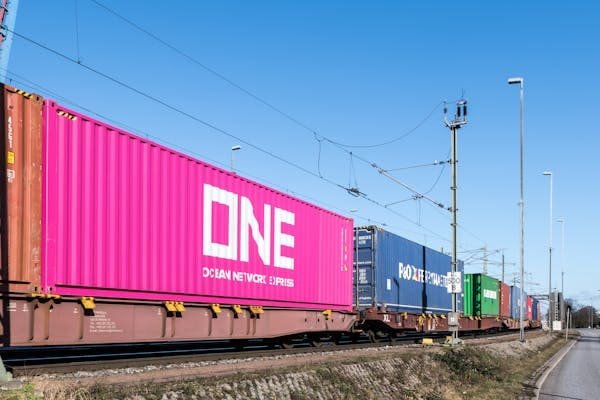 alt text: Train of the China-Europe Railway Express crossing a vast landscape