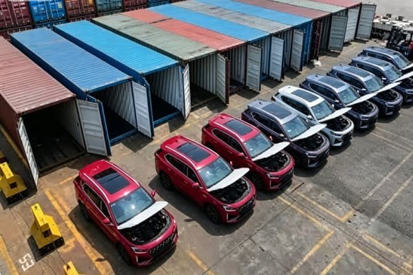 A 40-foot High Cube container next to a standard container