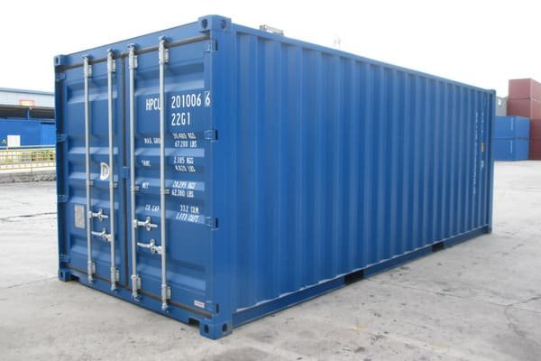 A container ship with neatly stacked containers, some with DG placards visible.