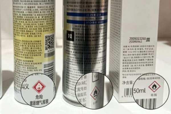 A shipping container with a warning label partially obscured