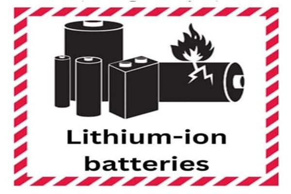 Close-up of a lithium-ion battery with a warning symbol