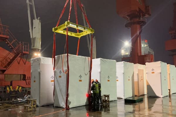 A shipping container being inspected at a port