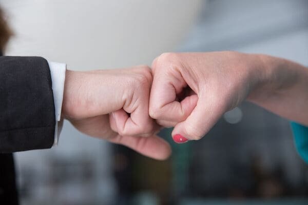 A person shaking hands with a logistics partner