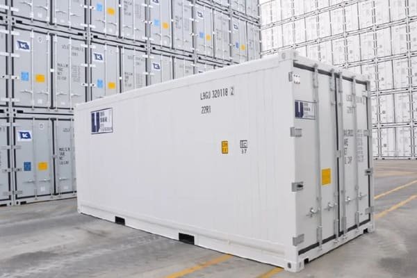 A logistics professional inspecting an ESS cabinet with a checklist before shipping.
