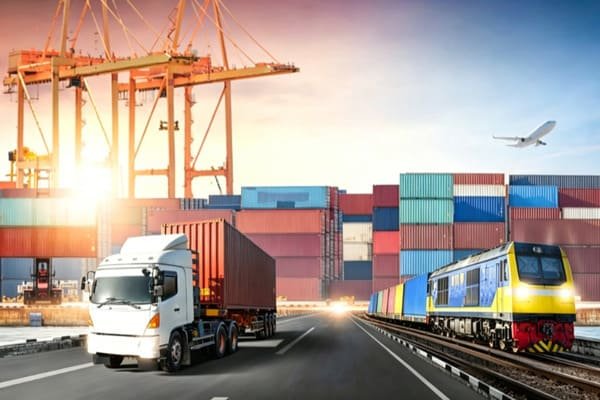 A truck transferring a container from a rail yard
