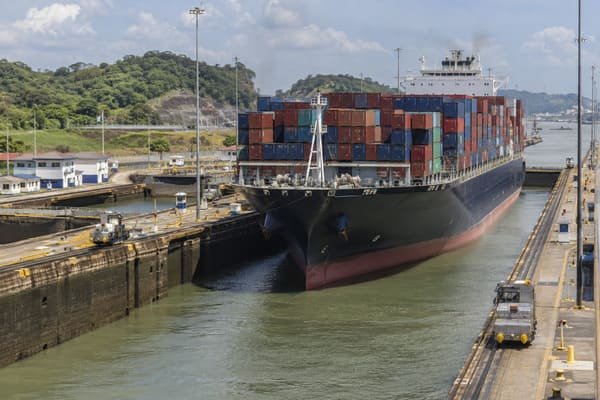A container ship navigating the Panama Canal locks